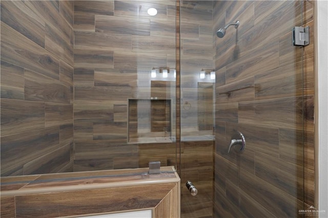 bathroom with a tile shower