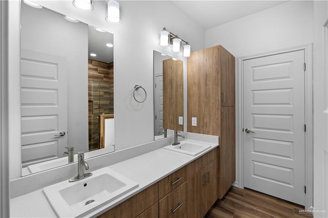 bathroom with vanity and hardwood / wood-style flooring