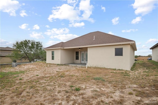 back of property featuring french doors, ceiling fan, and a patio area