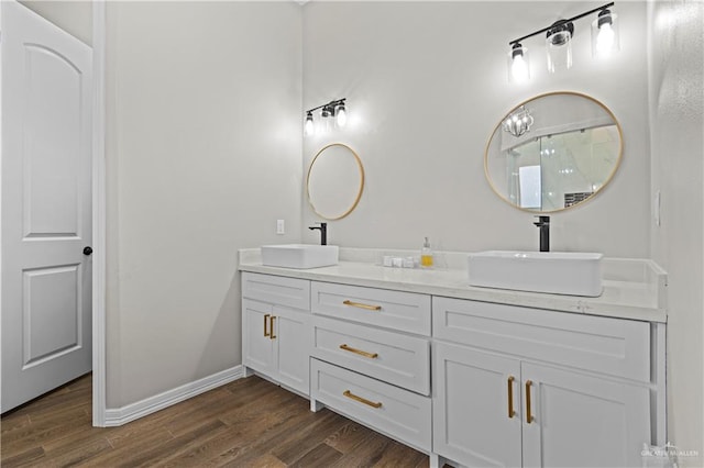 bathroom with vanity and wood-type flooring