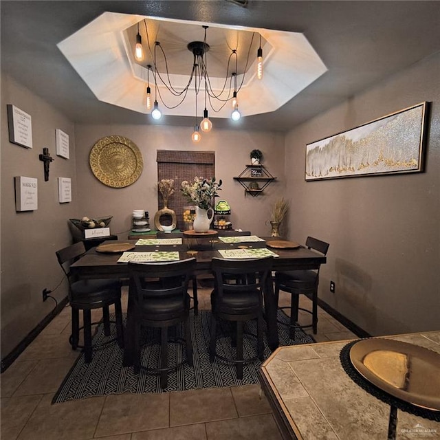 3312 Sanoma Dr, Weslaco, TX 78599 - tiled dining room with baseboards and a chandelier