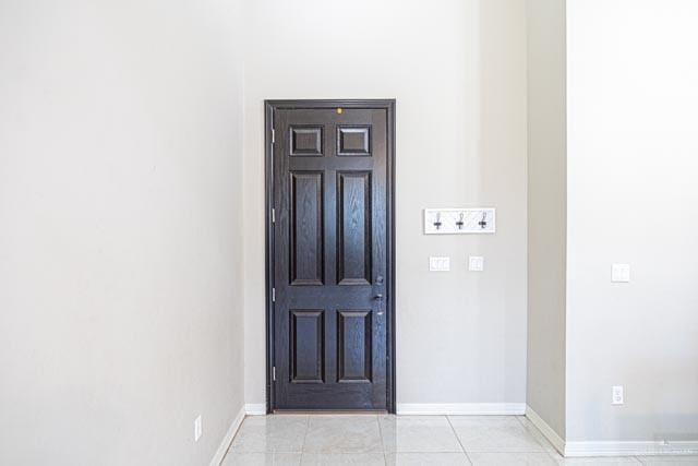 entryway with light tile patterned floors