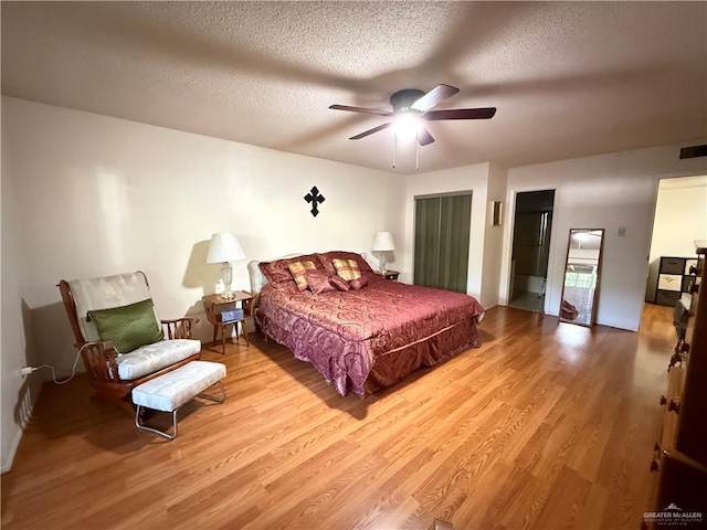 800 E Dallas Ave Unit 17, Mcallen, TX 78501 - bedroom with wood finished floors, a textured ceiling, and ceiling fan