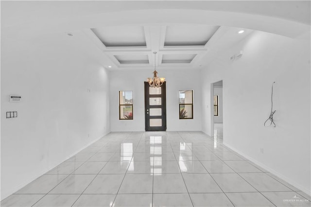 interior space featuring beam ceiling, a notable chandelier, a towering ceiling, light tile patterned flooring, and coffered ceiling