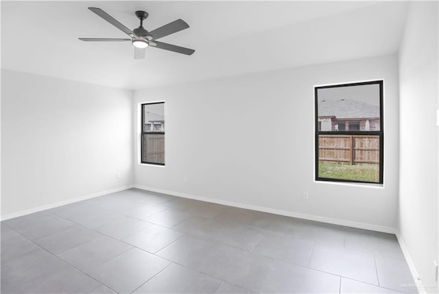 spare room with ceiling fan