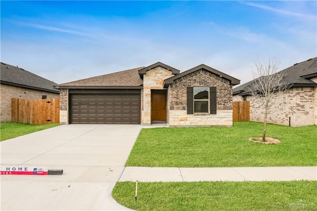 ranch-style home with a garage and a front lawn