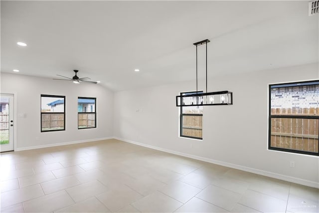 empty room with lofted ceiling and ceiling fan