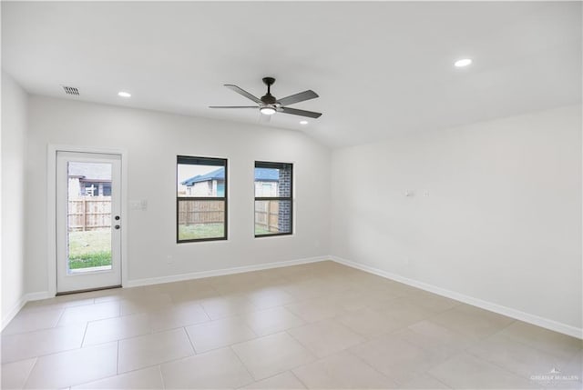 spare room featuring lofted ceiling and ceiling fan