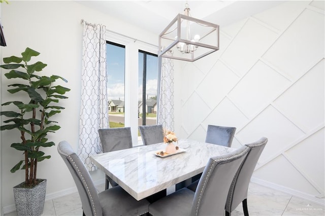 dining space with a chandelier