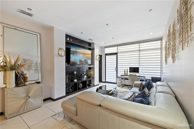 813 Travis St Unit 203, Mission, TX 78572 - living room featuring light tile patterned floors and an office area