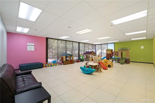 813 Travis St Unit 203, Mission, TX 78572 - playroom with a paneled ceiling and a wall of windows