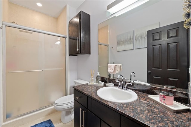 813 Travis St Unit 203, Mission, TX 78572 - bathroom featuring a shower stall, vanity, and tile patterned floors