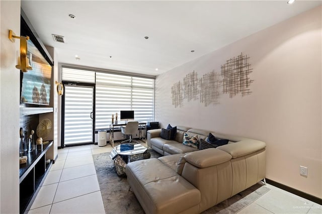 813 Travis St Unit 203, Mission, TX 78572 - tiled living room featuring an office area