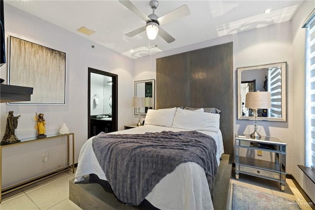813 Travis St Unit 203, Mission, TX 78572 - bedroom with a ceiling fan, ensuite bathroom, and light tile patterned flooring
