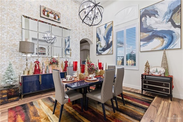 dining room with a chandelier and hardwood / wood-style floors