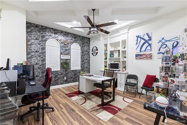 home office with ceiling fan, built in features, and wood-type flooring