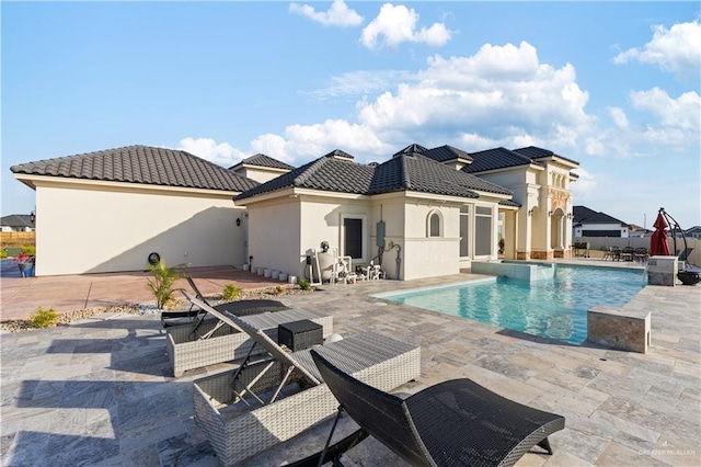 view of swimming pool with a patio area