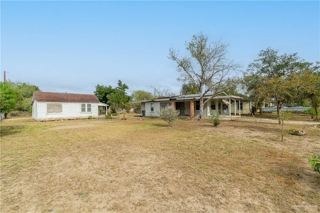 view of yard featuring covered porch