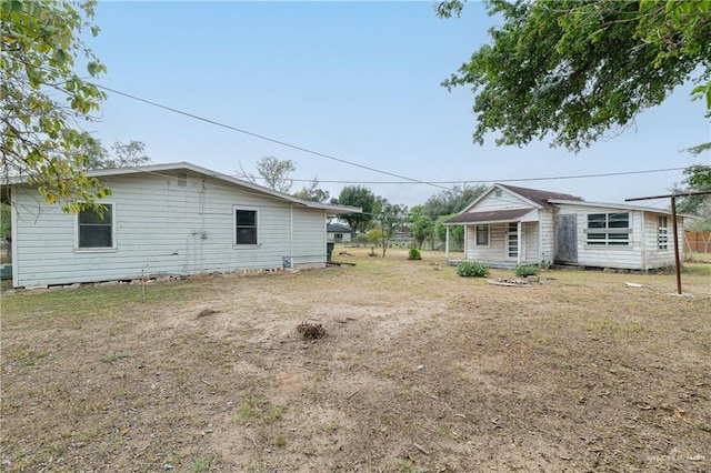 rear view of property with a porch