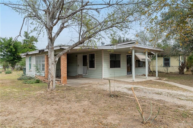 view of front of property with a patio