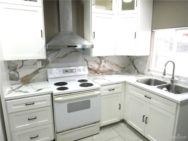 kitchen featuring sink, white cabinets, white range with electric cooktop, light stone countertops, and wall chimney range hood