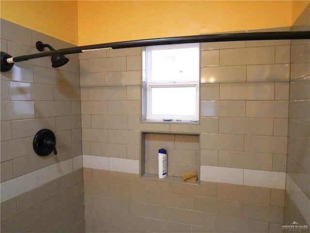 bathroom with a tile shower