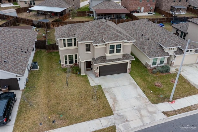 birds eye view of property with a residential view