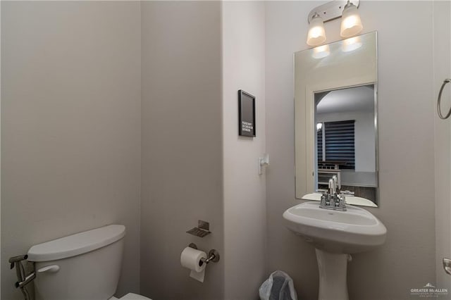 bathroom featuring toilet