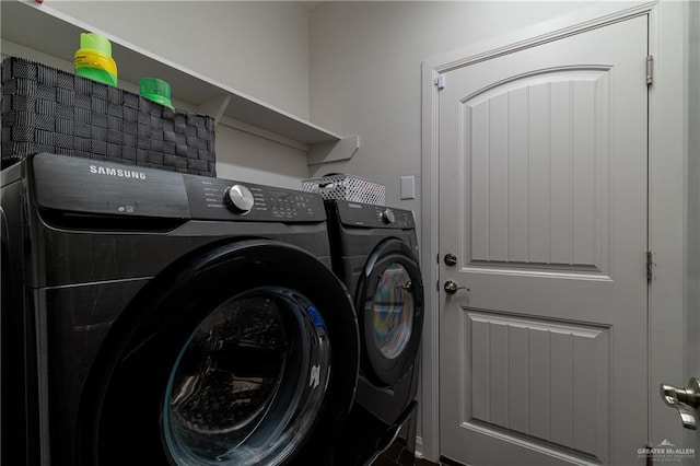 washroom featuring laundry area and washer and dryer