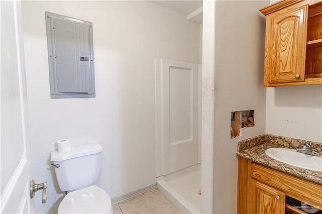 bathroom with walk in shower, vanity, tile patterned flooring, toilet, and electric panel