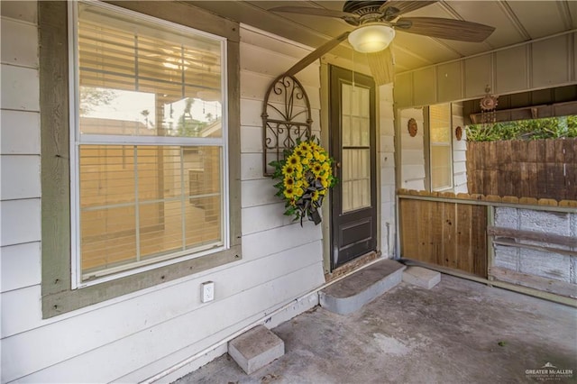 entrance to property with ceiling fan