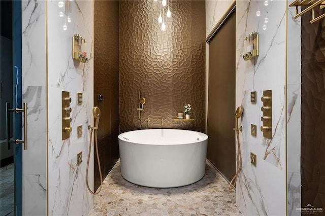 4704 Estancia Pkwy, Mcallen, TX 78504 - full bath featuring a freestanding bath, a marble finish shower, and wallpapered walls