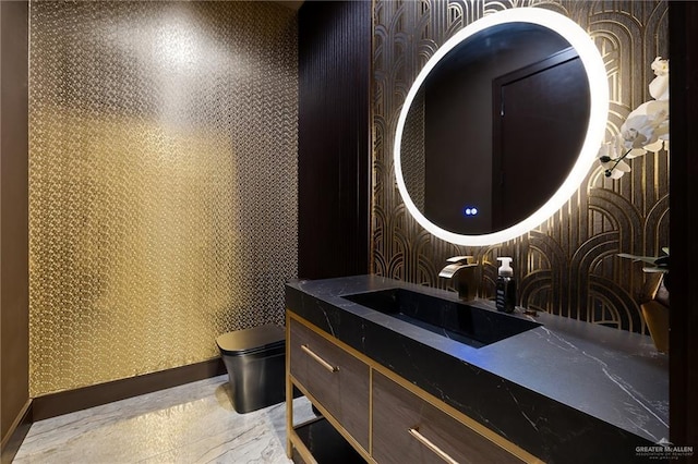 4704 Estancia Pkwy, Mcallen, TX 78504 - bathroom with toilet, vanity, wallpapered walls, and baseboards