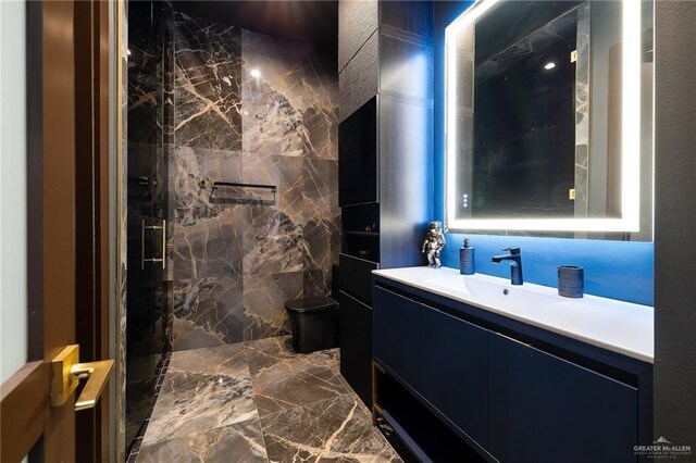 4704 Estancia Pkwy, Mcallen, TX 78504 - full bathroom featuring marble tiled flooring, toilet, vanity, and a marble finish shower