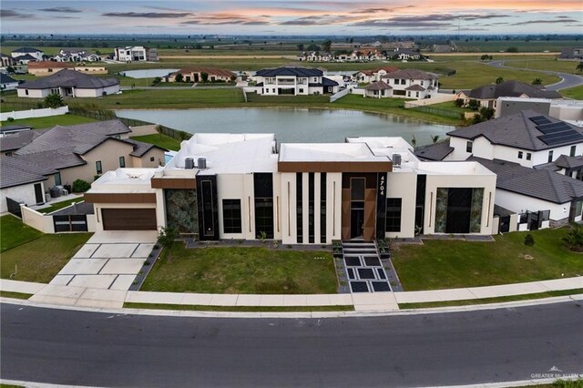 4704 Estancia Pkwy, Mcallen, TX 78504 - view of front facade featuring a water view, stucco siding, and a residential view