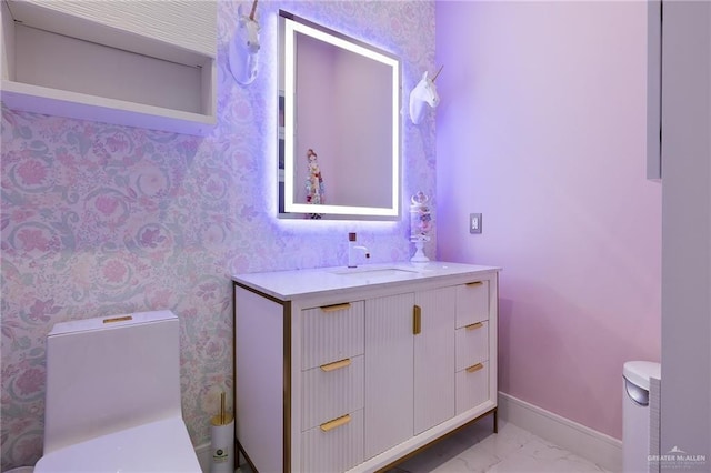 4704 Estancia Pkwy, Mcallen, TX 78504 - bathroom with toilet, baseboards, marble finish floors, vanity, and wallpapered walls