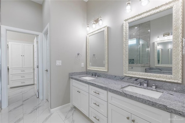 3205 Brentwood St, Edinburg, TX 78539 - bathroom with marble look tiles, double vanity, baseboards, and a tile shower