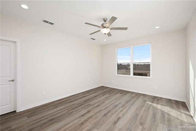 1420 Zurich Ave, Mcallen, TX 78504 - empty room featuring ceiling fan, recessed lighting, baseboards, wood finished floors, and visible vents