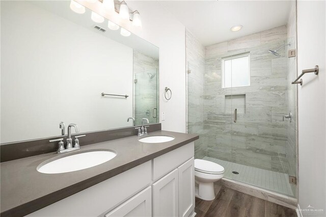 1420 Zurich Ave, Mcallen, TX 78504 - full bathroom featuring double vanity, a sink, a stall shower, and visible vents