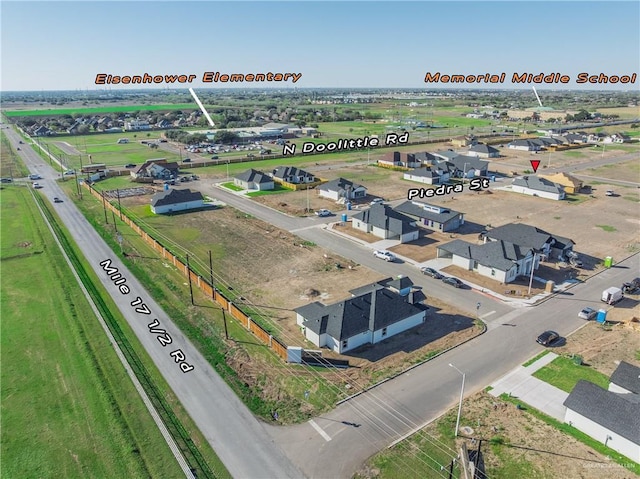 birds eye view of property with a residential view