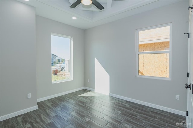 unfurnished room with baseboards, dark wood finished floors, a ceiling fan, and recessed lighting