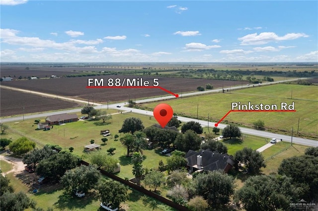 birds eye view of property featuring a rural view