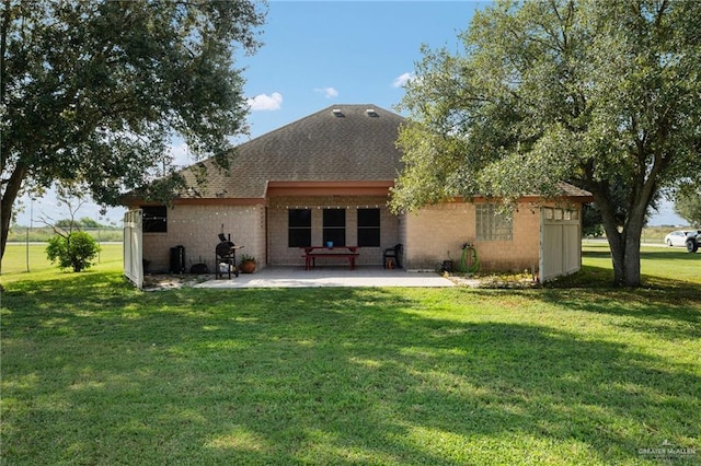 rear view of property with a patio area and a lawn