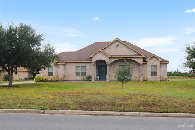 ranch-style home with a front lawn