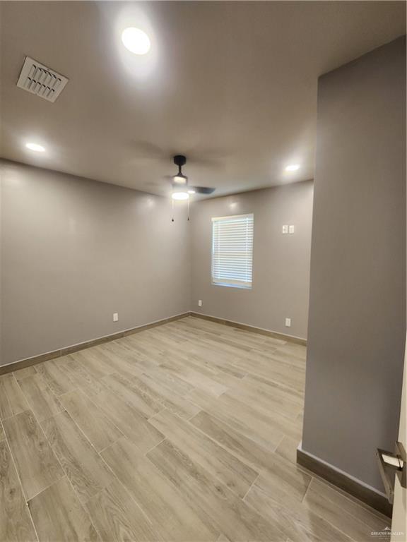 607 N Padre Ave, Weslaco, TX 78596 - spare room with a ceiling fan, light wood-style flooring, and recessed lighting