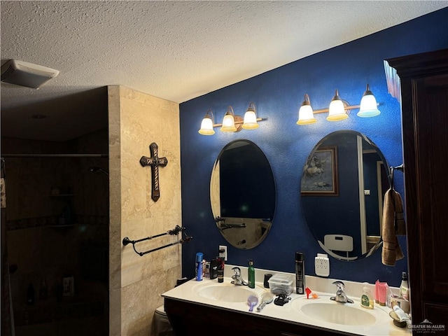 bathroom featuring vanity and a textured ceiling