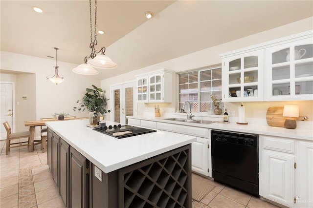 2009 E 29th St, Mission, TX 78574 - kitchen with black appliances, a sink, white cabinets, vaulted ceiling, and recessed lighting