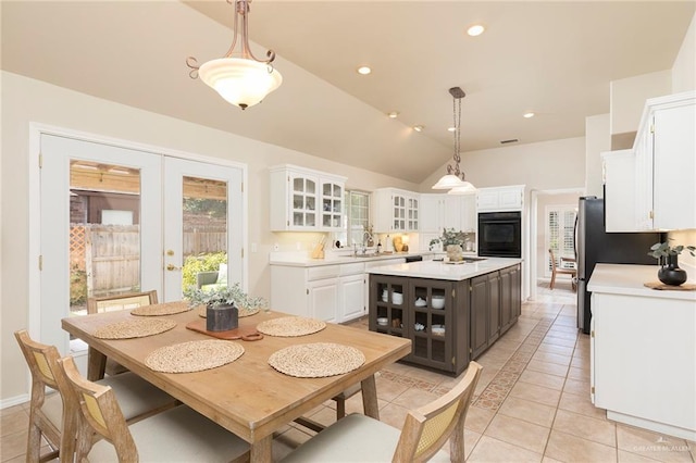 2009 E 29th St, Mission, TX 78574 - dining area featuring light tile patterned floors, vaulted ceiling, french doors, and recessed lighting