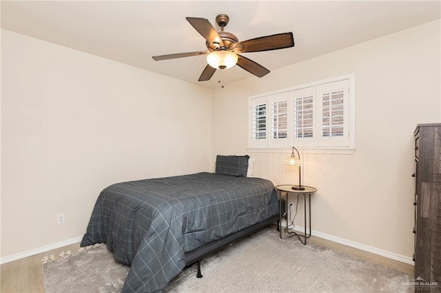 2009 E 29th St, Mission, TX 78574 - bedroom featuring baseboards, ceiling fan, and wood finished floors