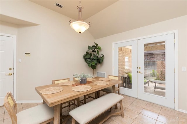2009 E 29th St, Mission, TX 78574 - dining room featuring light tile patterned flooring, lofted ceiling, french doors, and baseboards